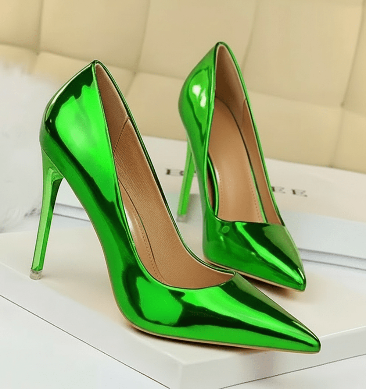 Shiny green high-heeled shoes