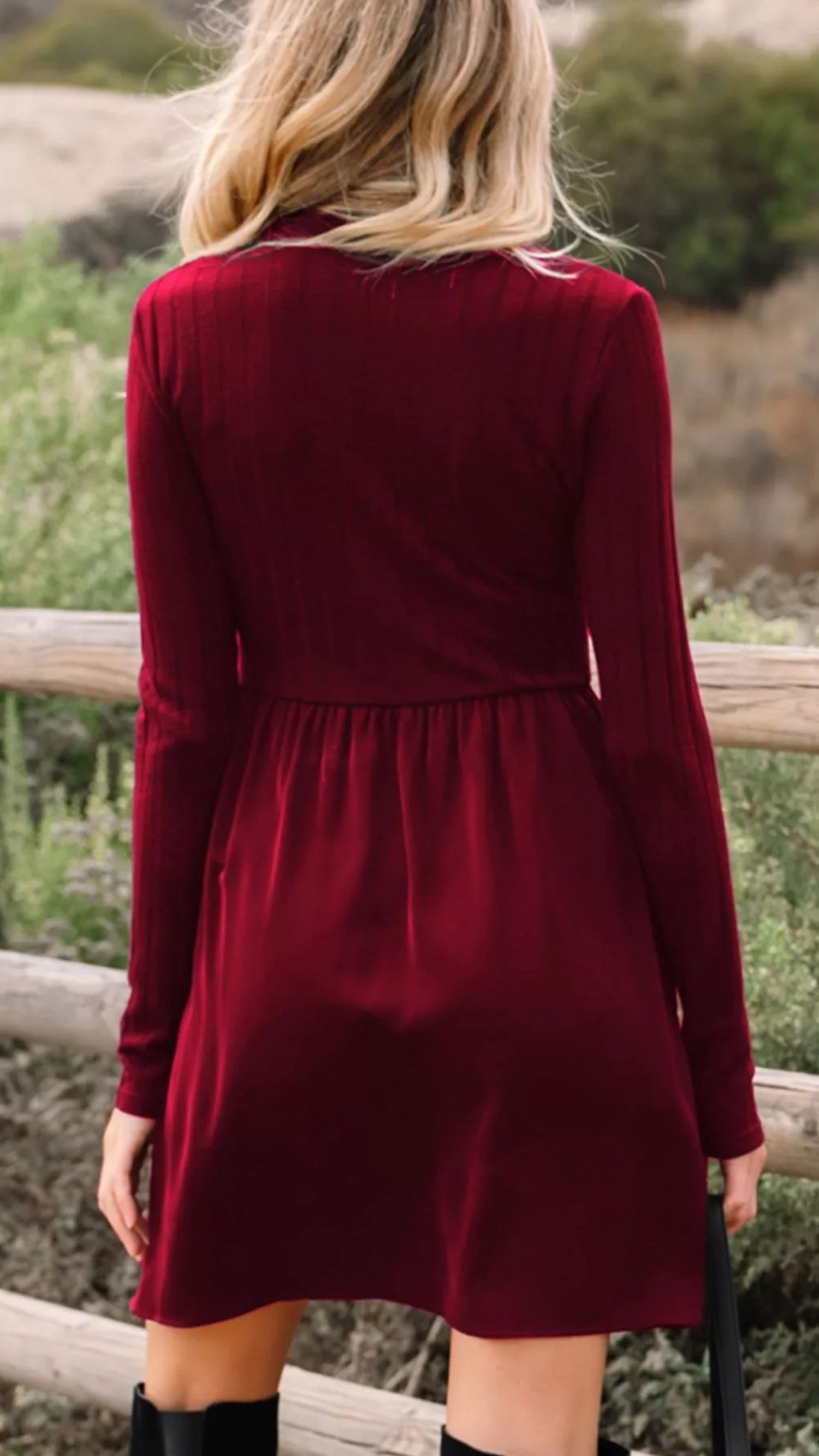 Person wearing a red dress standing outdoors
